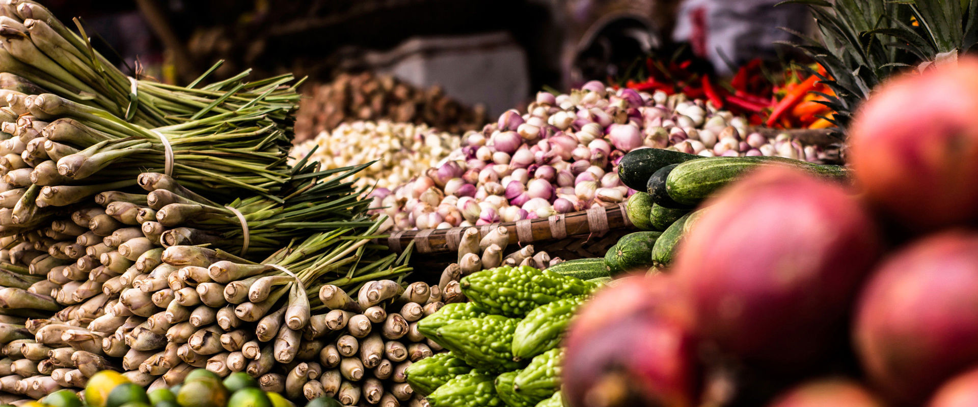Farmers' market Market benches full of fruit and vegetables.