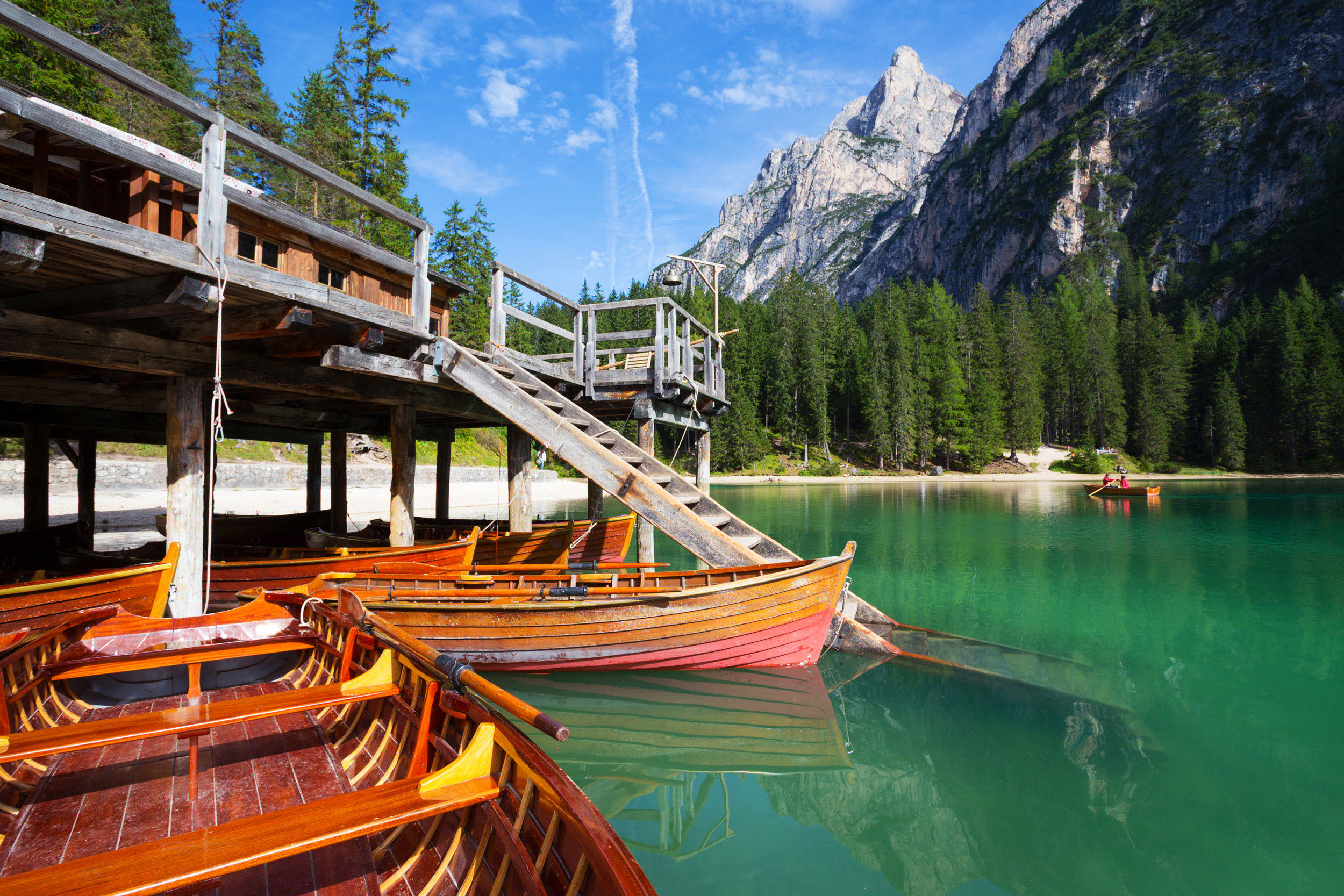 Close-up of the boathouse with the wooden boats at Lake Prags.
