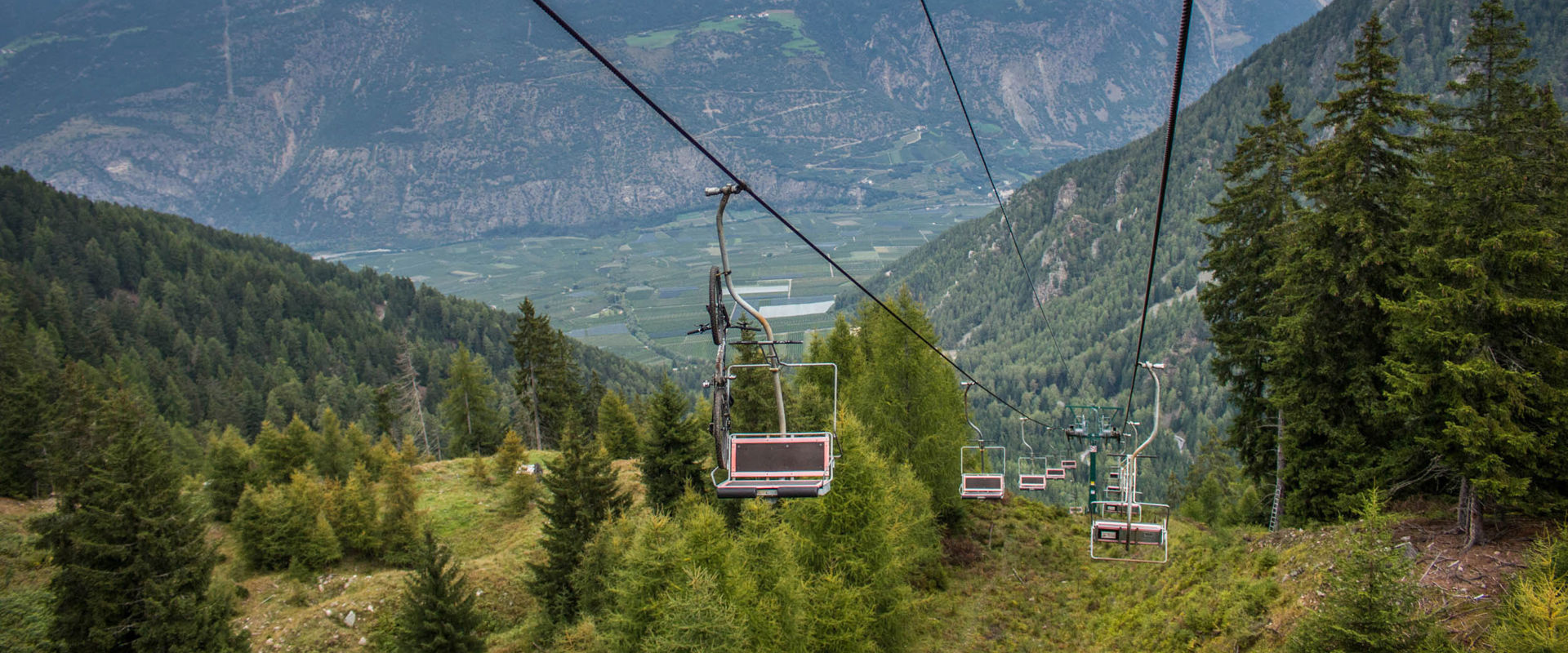 Chairlift Tarscher Alm Chairlift of the Tarscher Alm in the middle of a wooded mountain slope