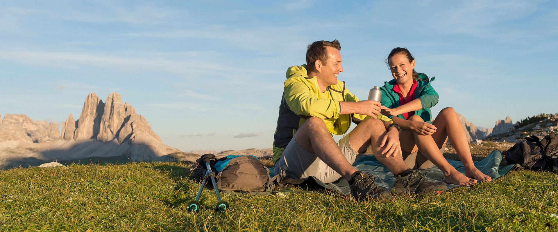 Vitalpina summer Man and woman picnicking on the mountain.
