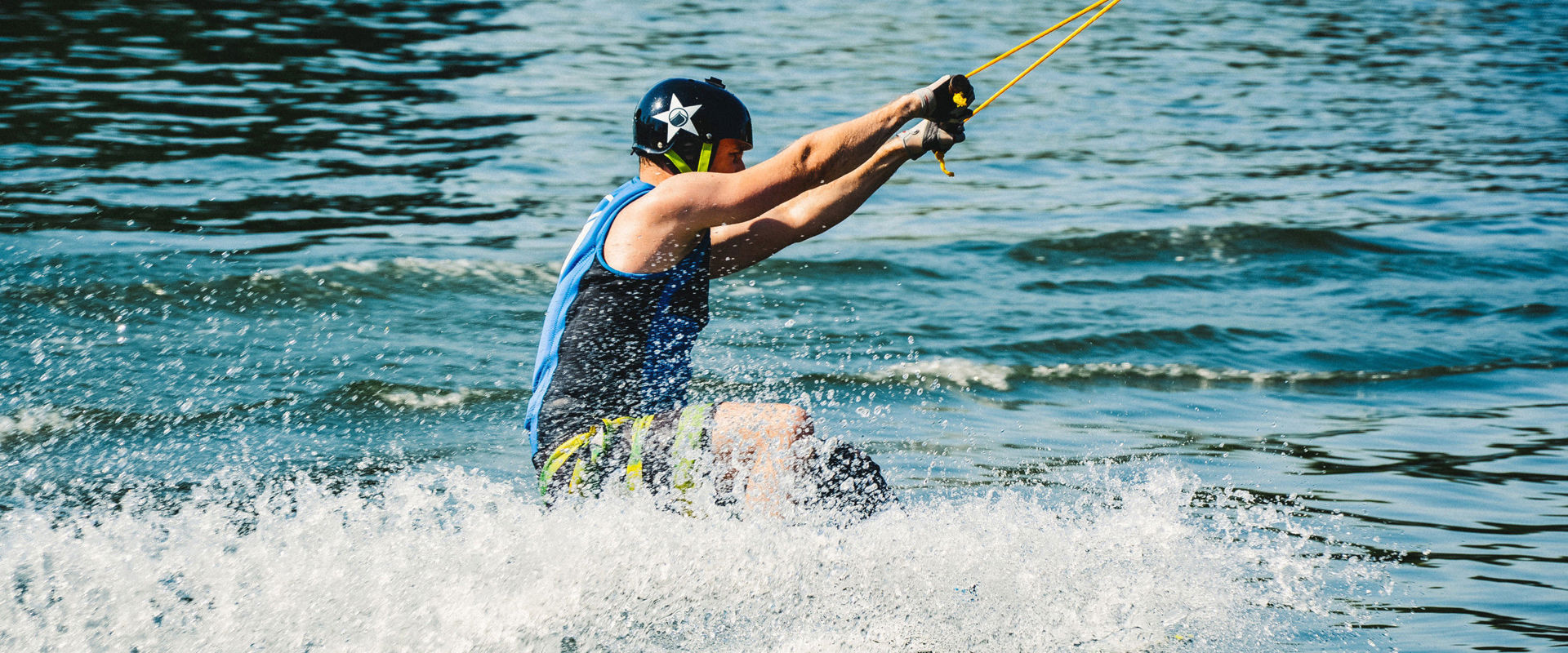 Kitesurfing in South Tyrol Boy kitesurfing in a lake in South Tyrol.