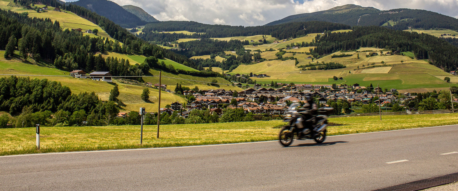 Riding motorbikes in South Tyrol A motorbike whizzes through the mountain roads of South Tyrol.