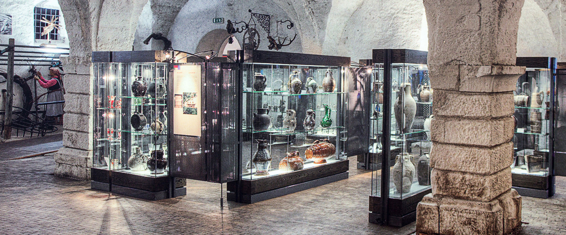 Wine Museum in Kaltern Showcases with various wine vessels.