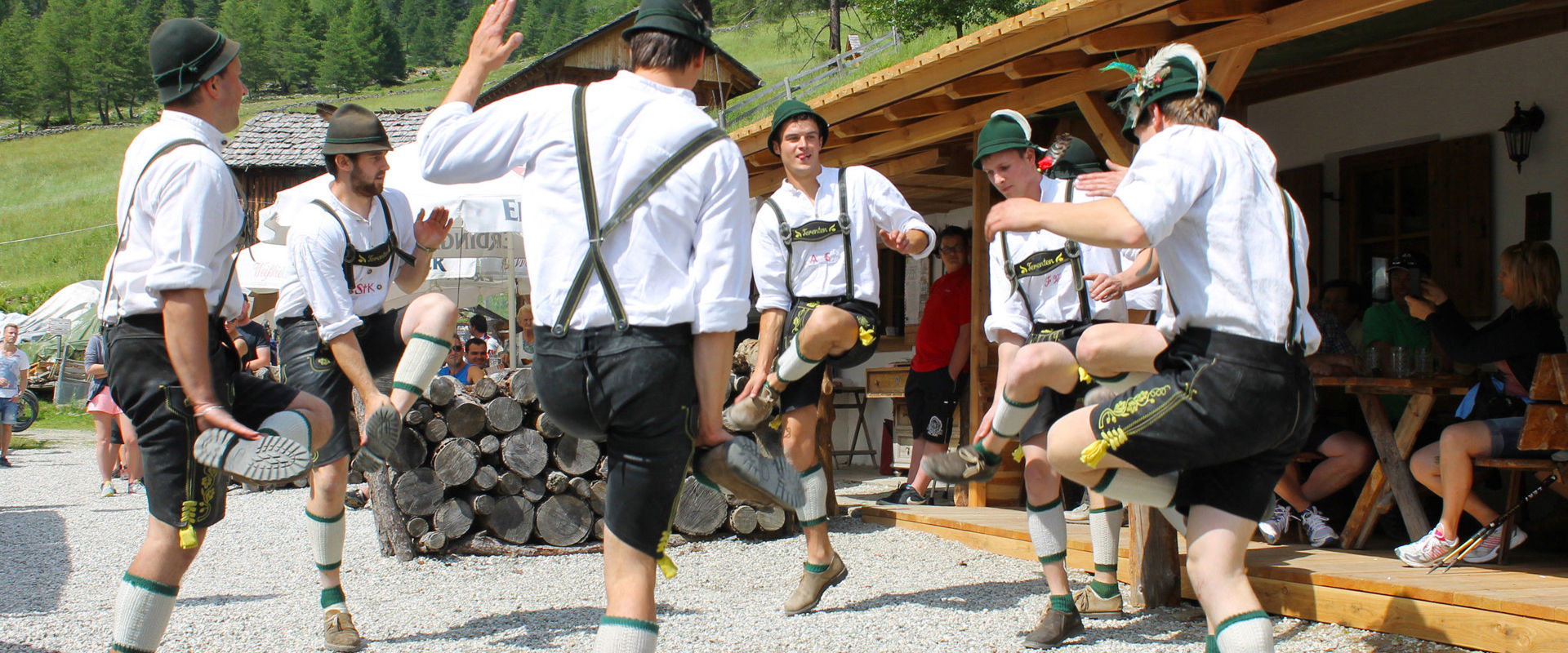 Men in "Lederhosen" perform a traditional South Tyrolean dance.