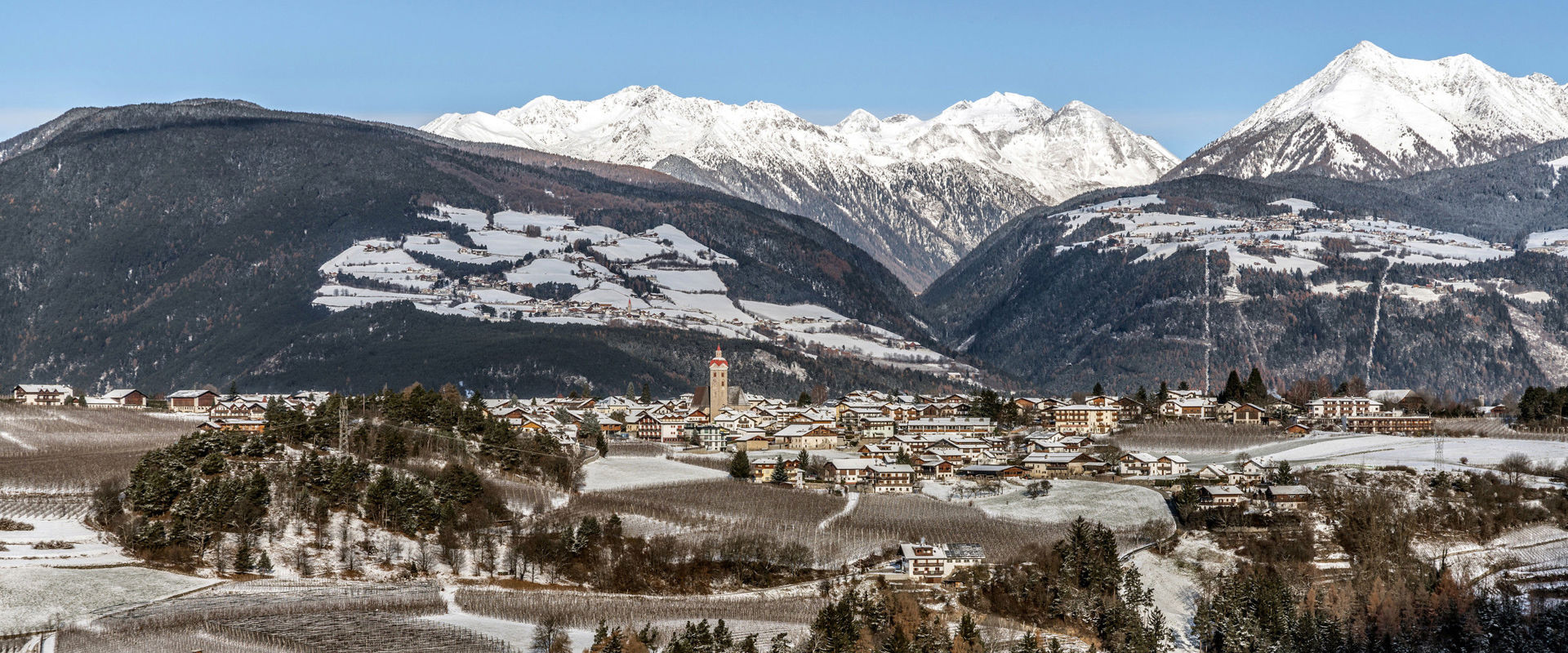 Natz View of Natz with parish church & Pfunders mountains in winter