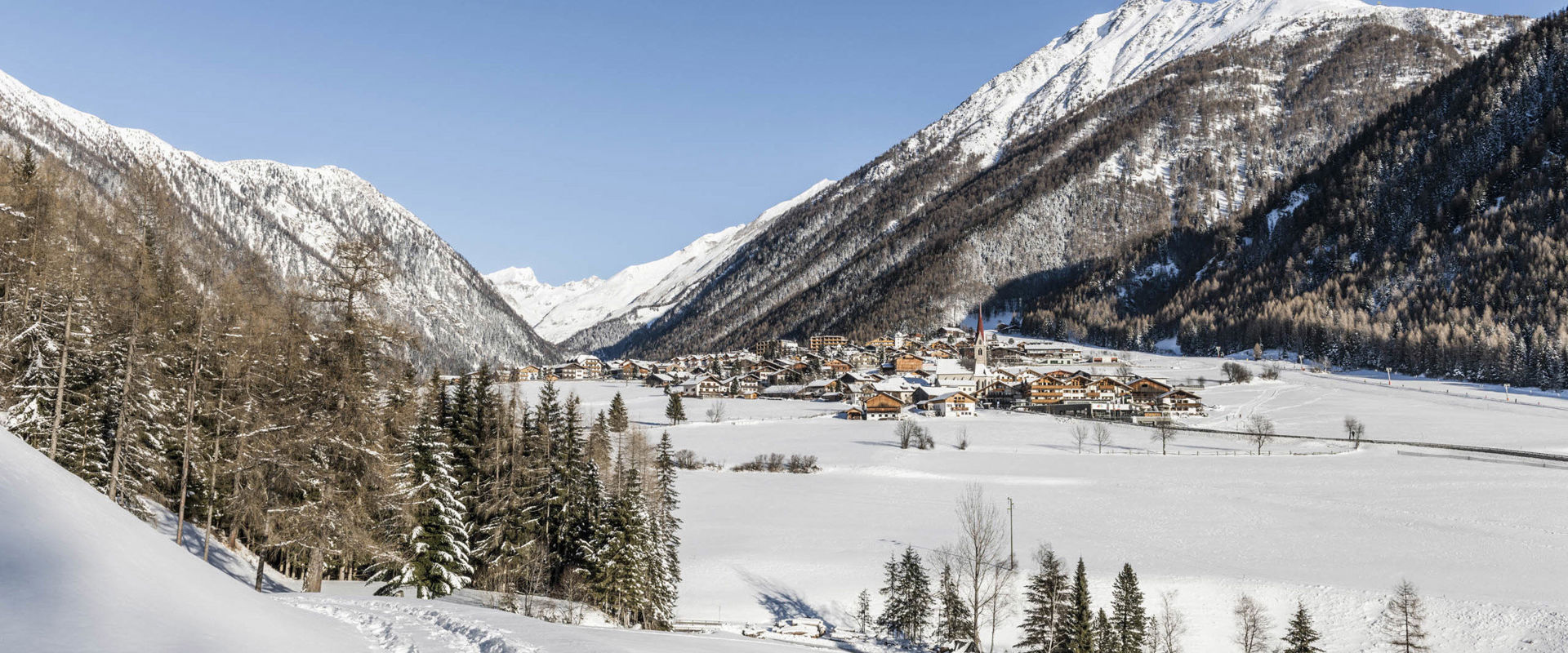 Winter hiking path in Vals with mountain view