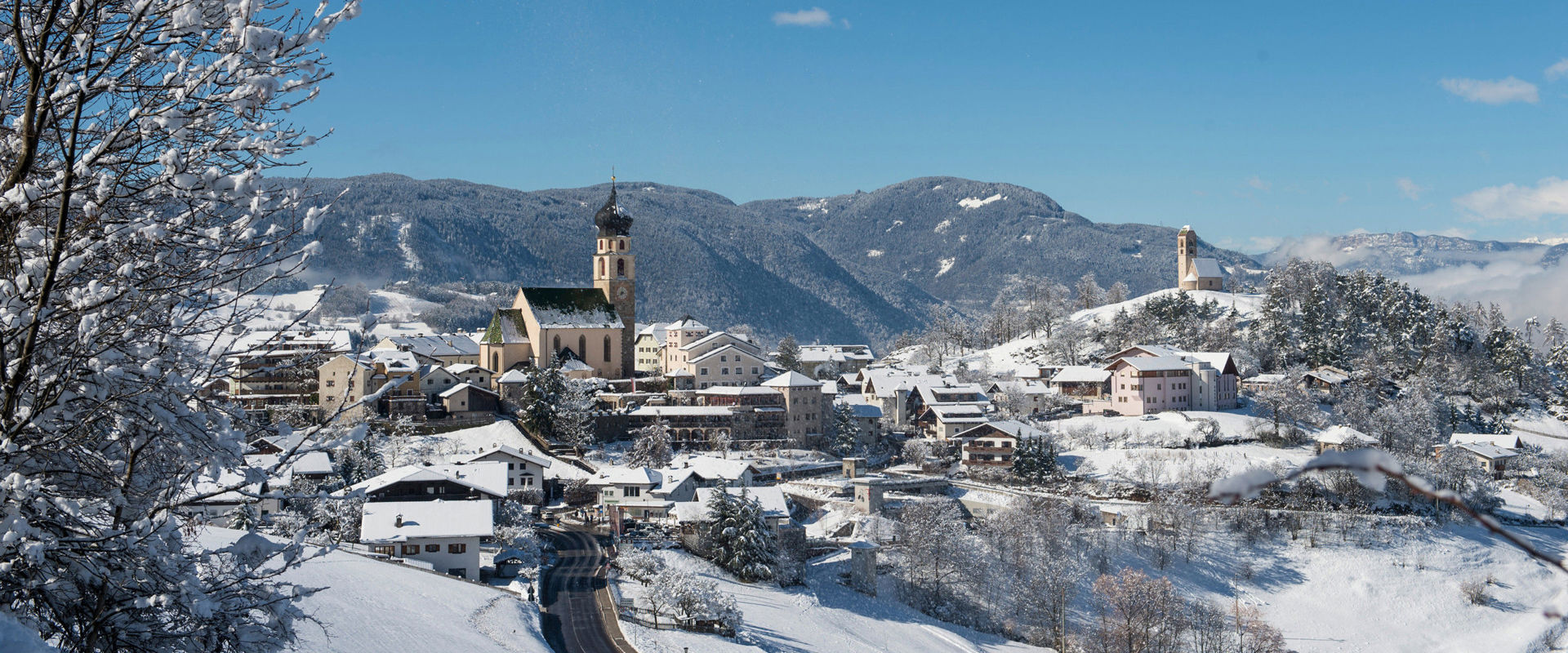Völs am Schlern in winter The mountain village of Völs am Schlern amidst a white wintry landscape.