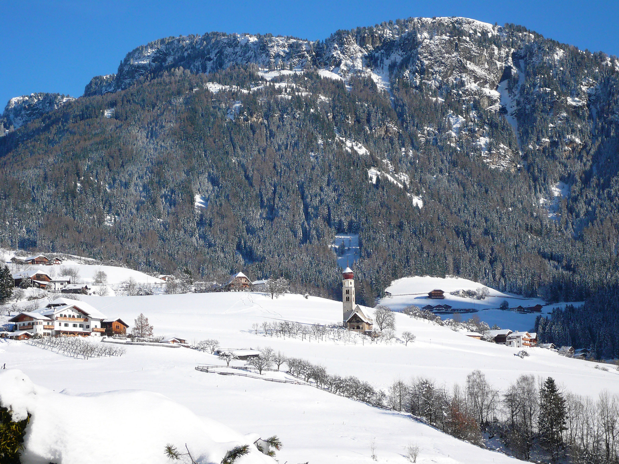 St. Valentine's Church lies lonely in the landscape covered with fresh snow.