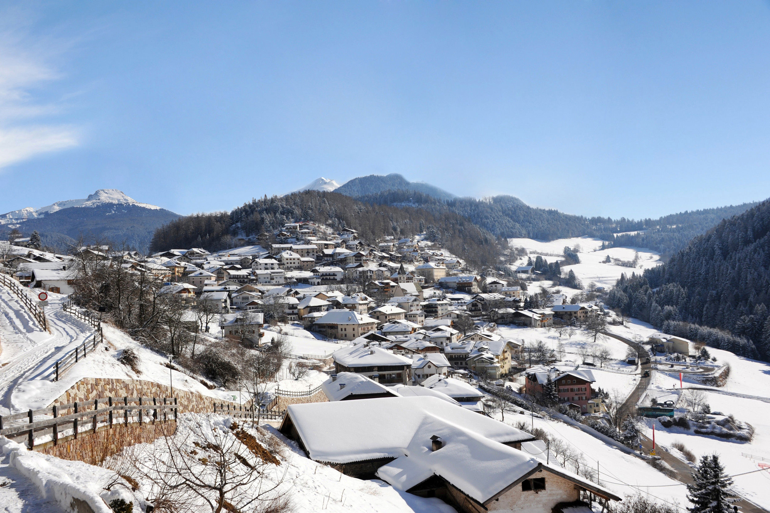 Truden nestled in a white winter landscape.