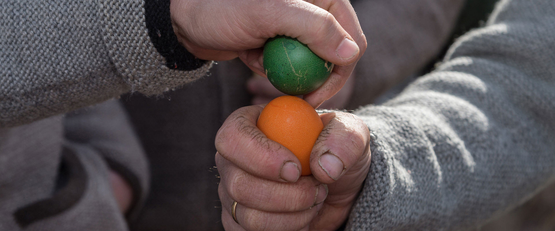 The tradition of egg pecking: an egg is cracked onto the tip of the opponent's egg.