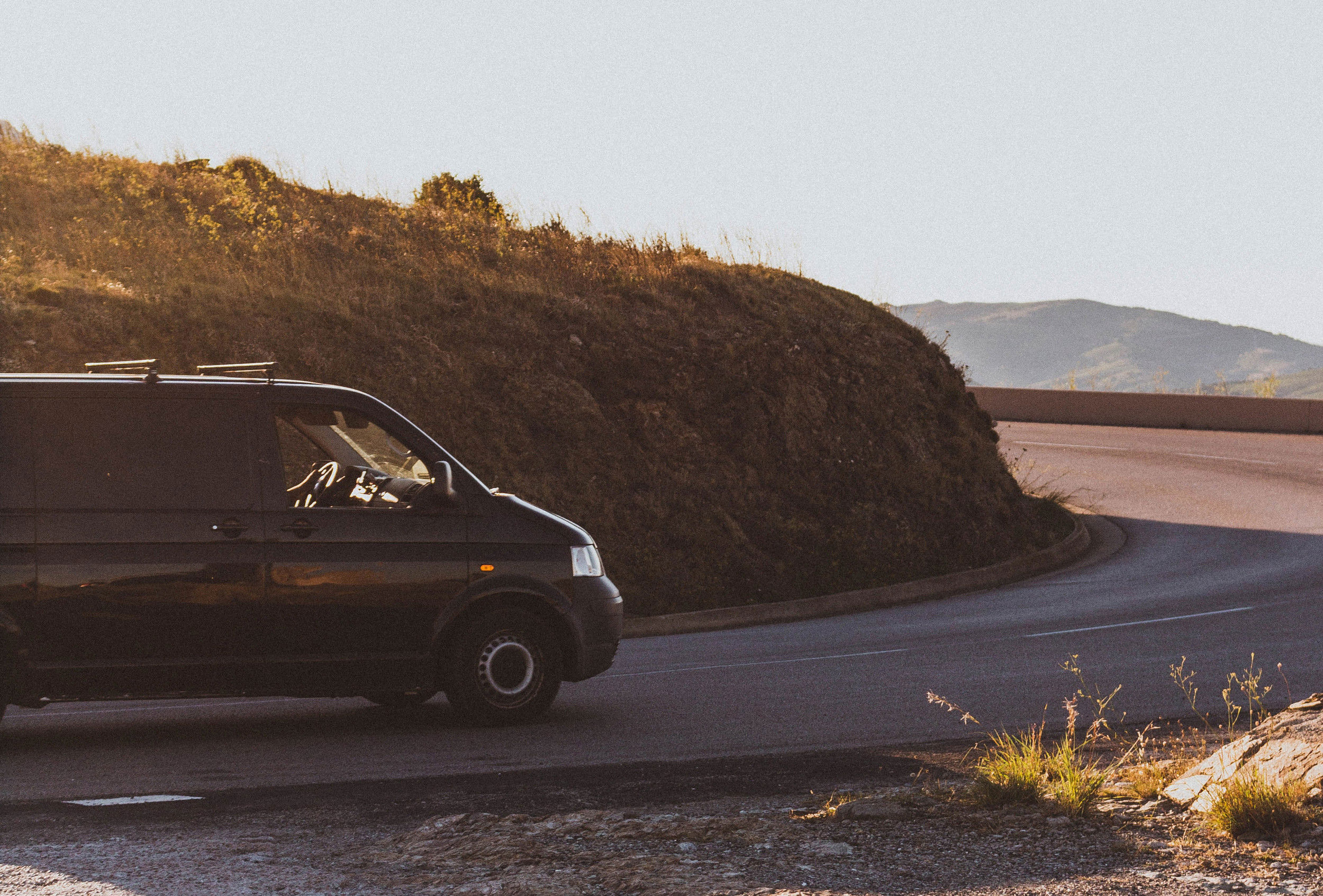 Photo of a black van on the road.