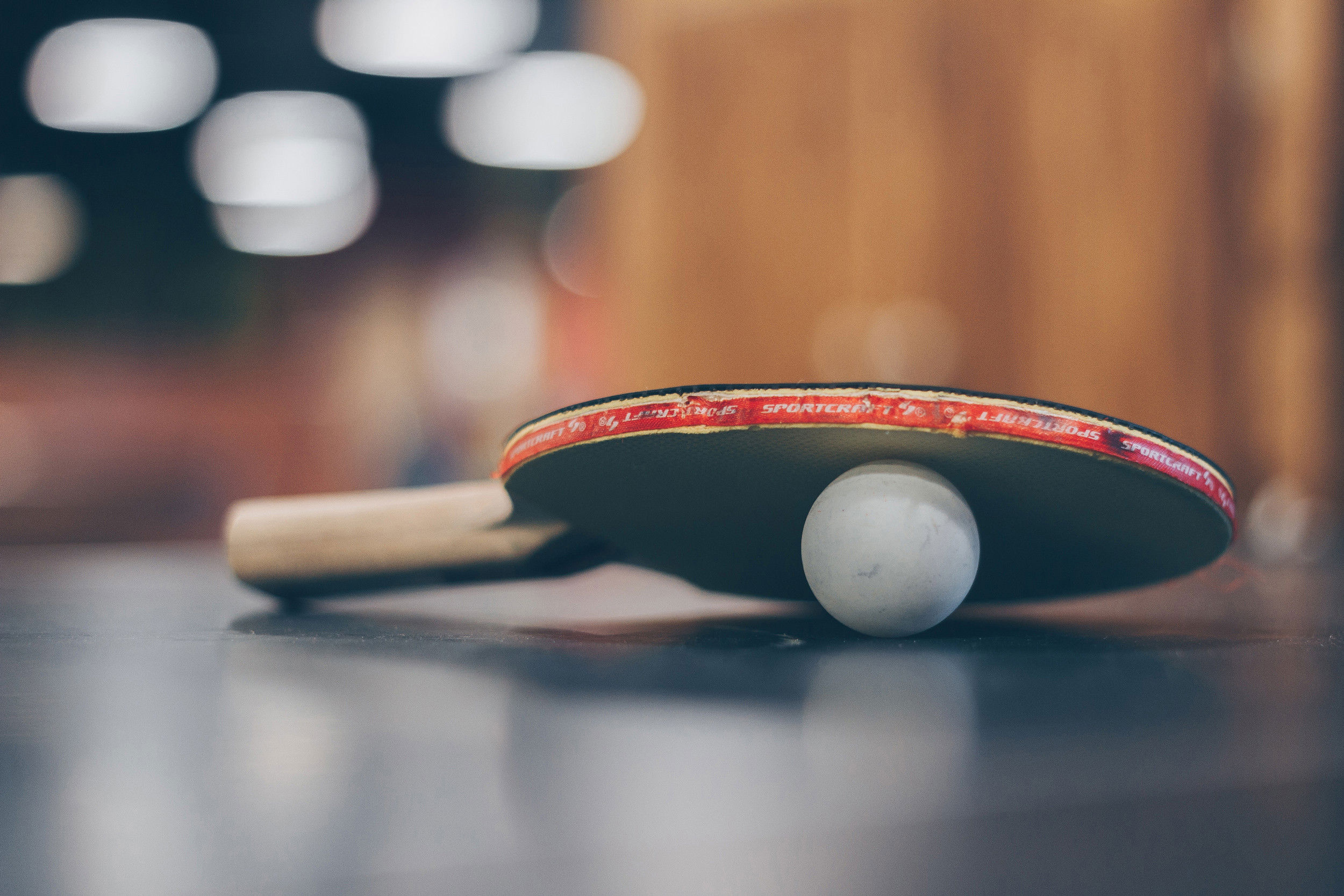 Table tennis bats and ball on the table tennis table.