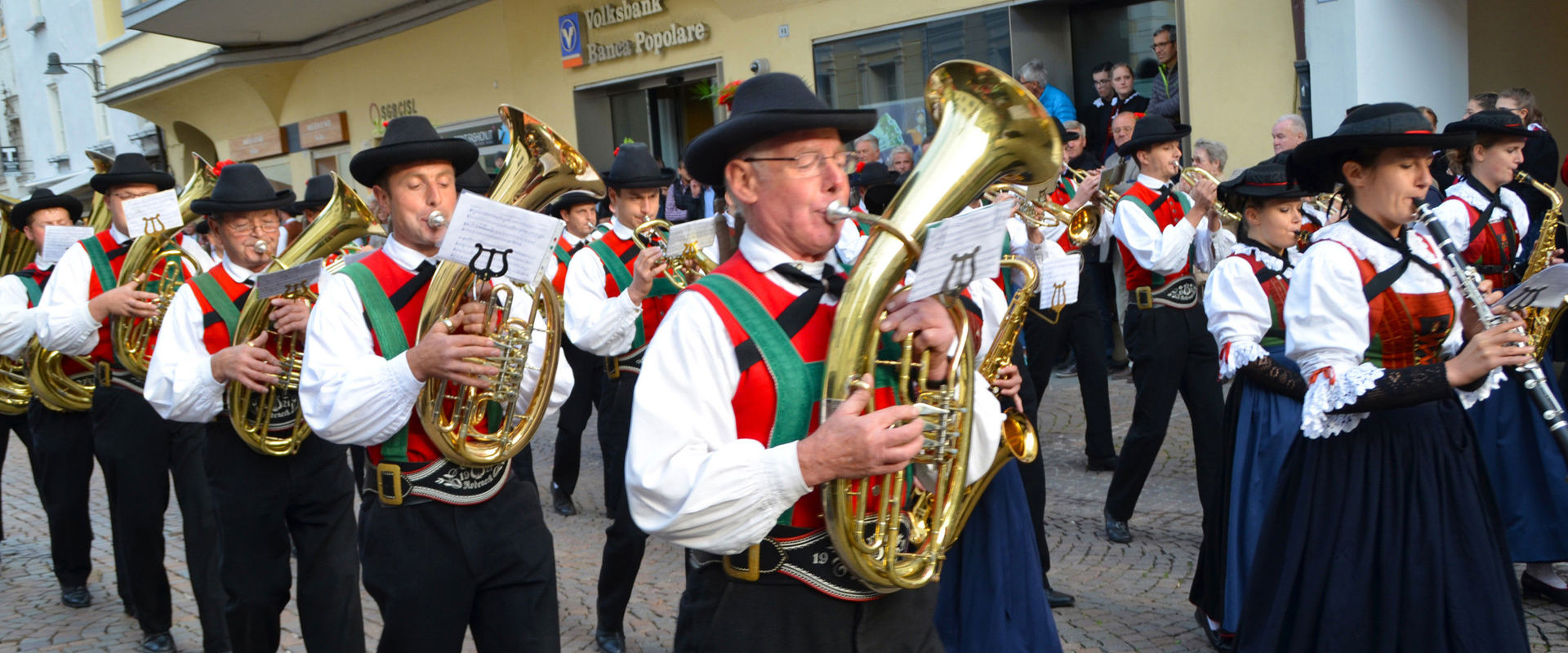 Band playing traditional music Band marches through the street.