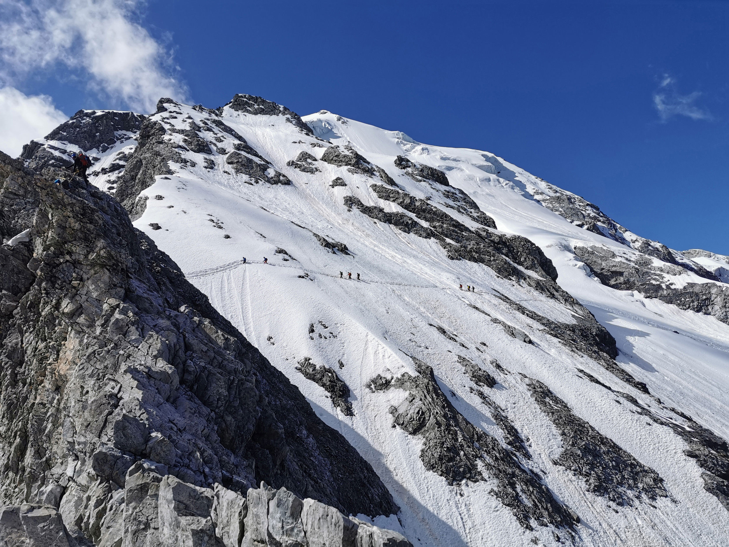 A group of hikers on the snow-covered Ortler.