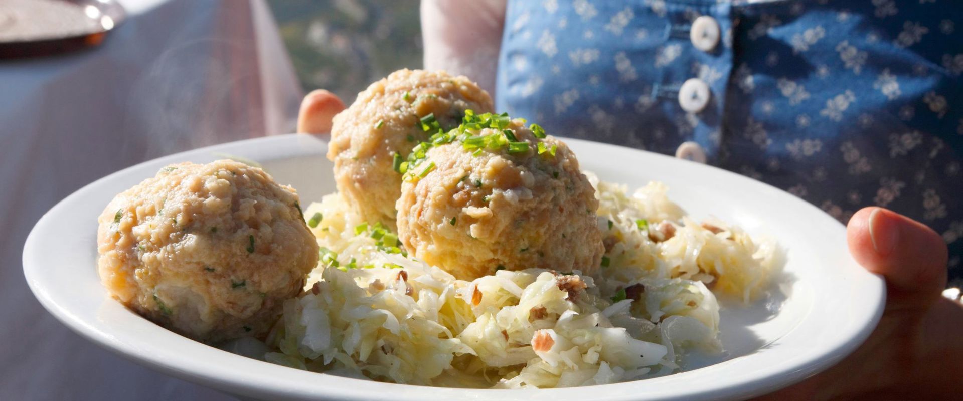 Dumplings Waitress serves 3 dumplings with coleslaw.