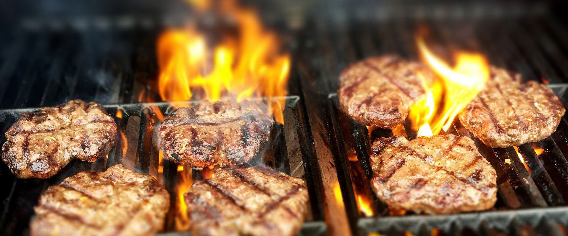 Barbecue areas Grill with 7 hamburger patties.