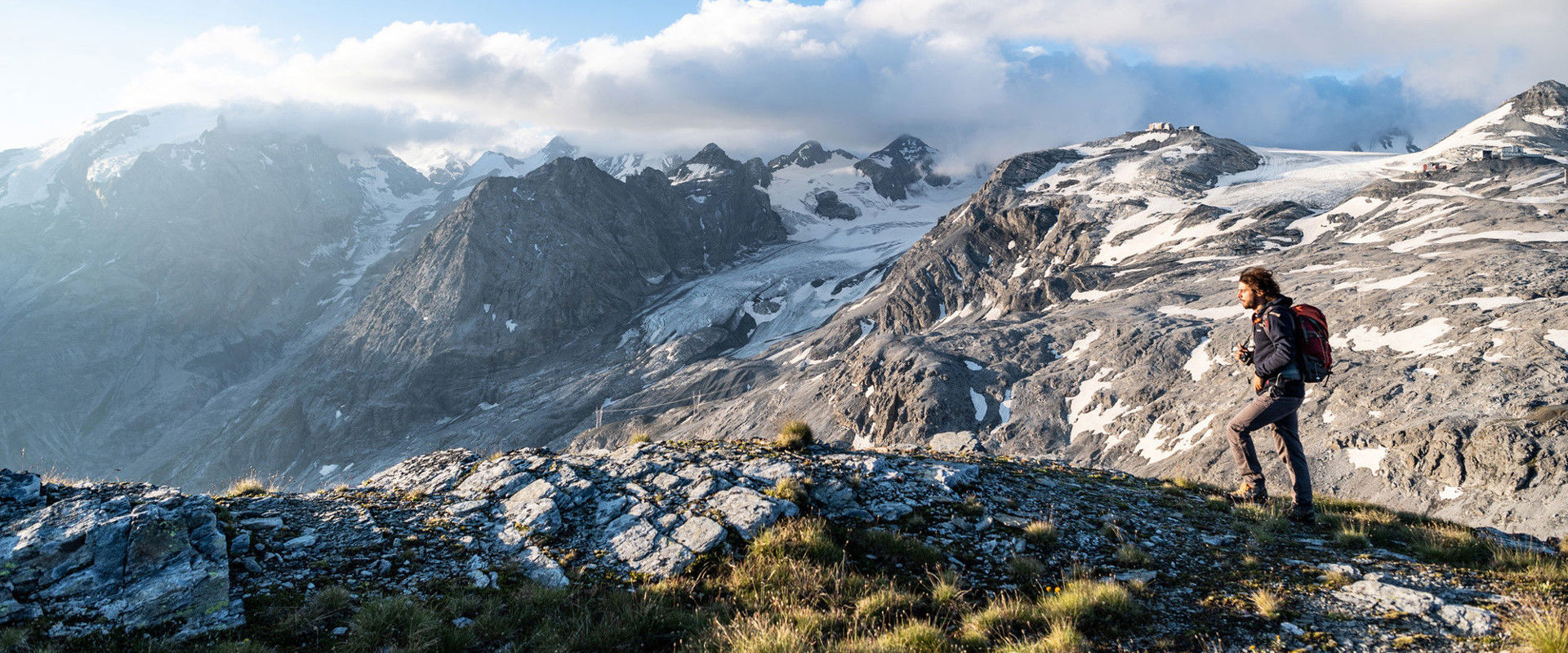 Winter hiking in South Tyrol Hiker high up on the mountain between the snow-covered peaks.