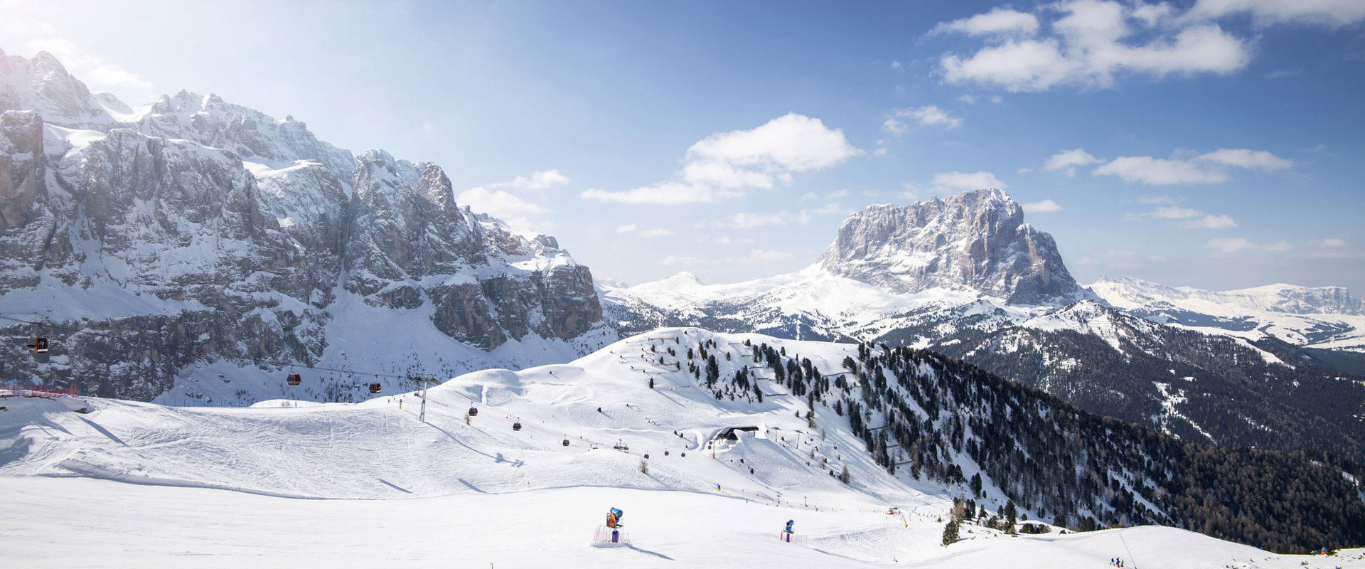 Breathtaking panoramic photo of the winter snowy landscape around the Sella Group.