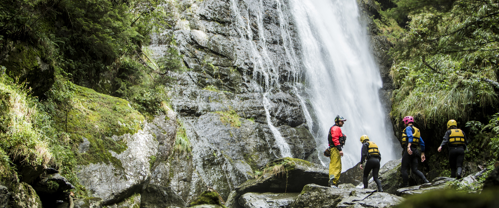 Canyoning Group canyoning at a waterfall