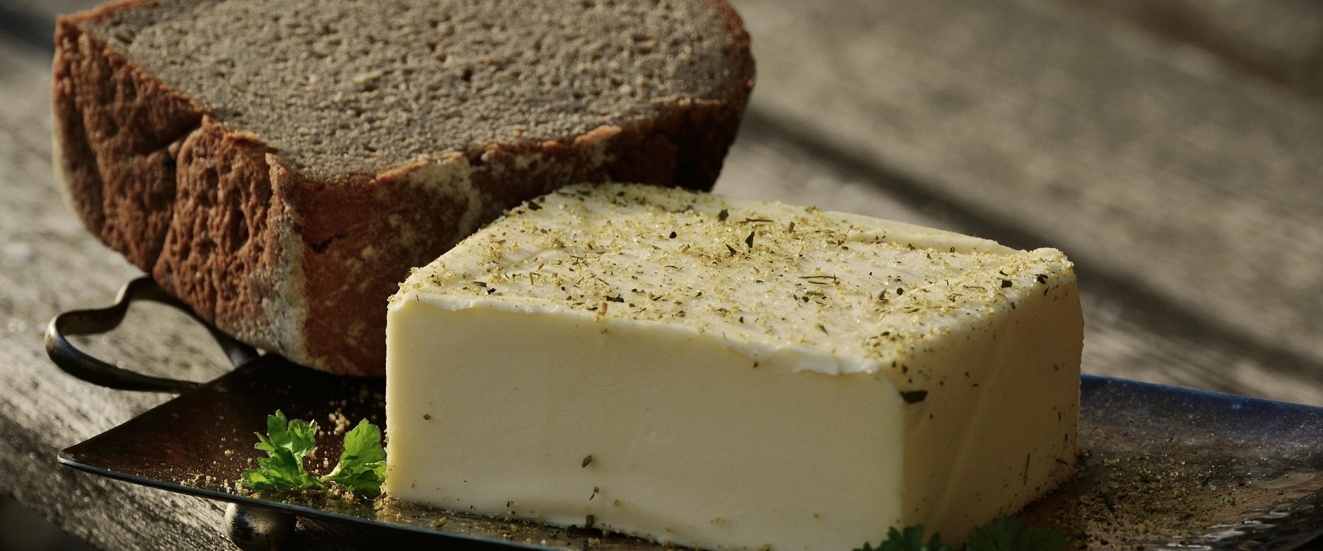 A loaf of butter flavoured with herb salt, to be enjoyed with black bread