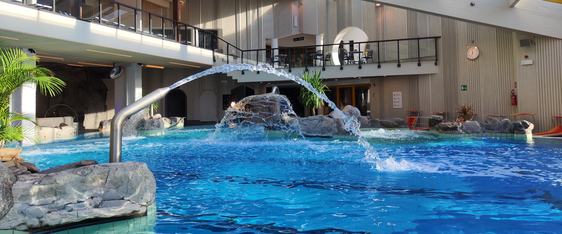 Indoor area adventure pool Naturns Indoor pool area with water slide, whirlpool, saltwater pool and current channel.